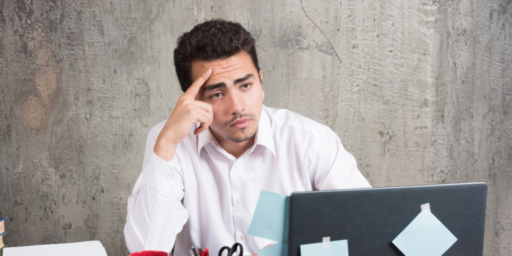 Disappointed CFA candidate reviewing exam results and planning a new study strategy after exam failure.